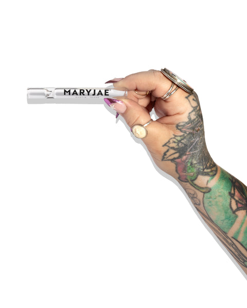 Hand holding a glass chillum with 'MARYJAE' branding on a white background