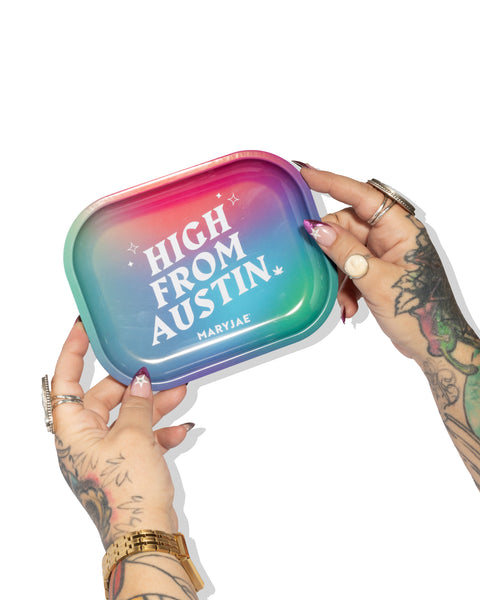 Hand holding a colorful tray with 'High from Austin' text, branded as Maryjae.